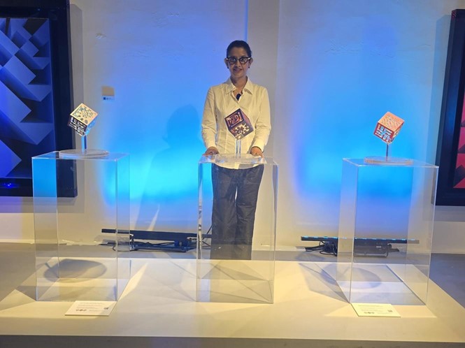 Lakshmi Mohanbabu with the three Deep Ocean Interactions Cubes at Gallery ART NOW, March 2025