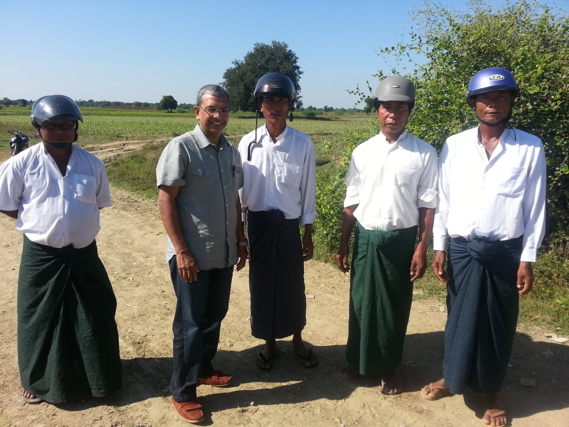With sunflower farmers and government officials in remote Myanmar