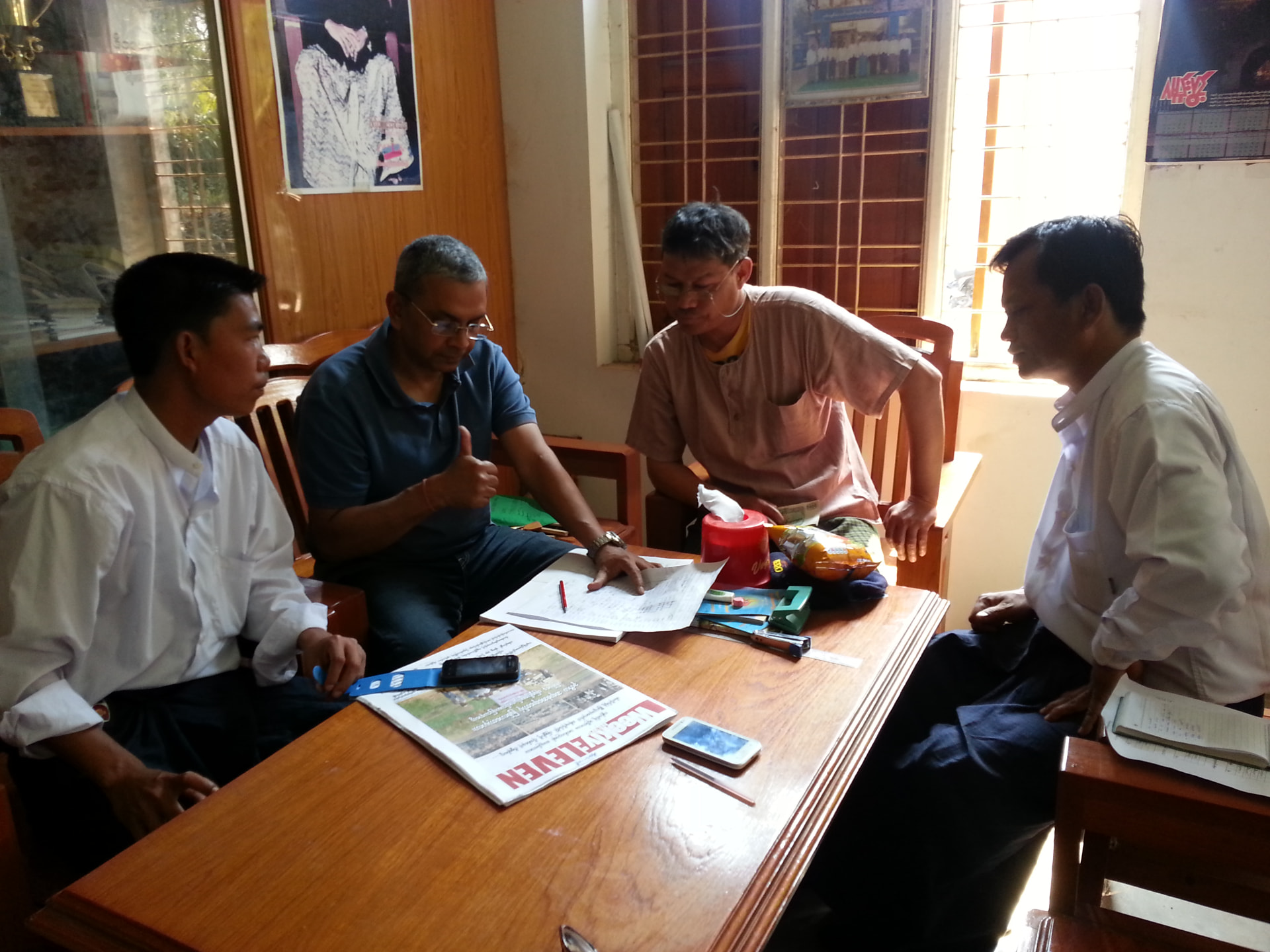 With sunflower farmers and government officials in remote Myanmar